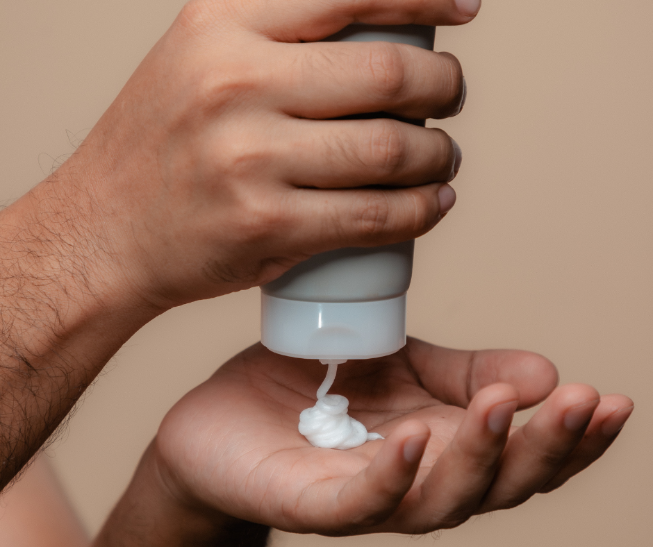 hands squeezing lotion